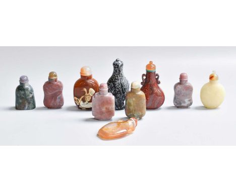 A Chinese Agate Snuff Bottle, carved to one side with ruyi branches and with banded stopper, together with a further nine Chi