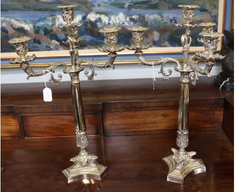 A Pair of Silver Plate Four-Light Candelabra, each on triform base, with tapering fluted stems and with three branches, each 