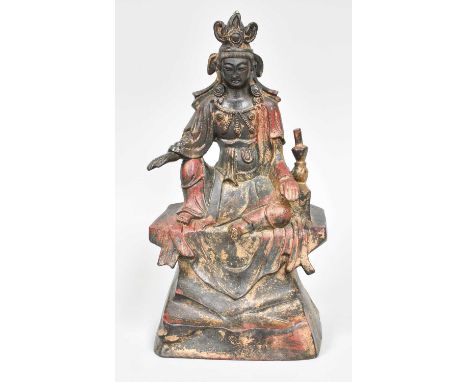 A Sino-Tibetan Parcel Gilt and Polychrome Cast Metal Statue of Buddha, seated on a plinth, 23cm