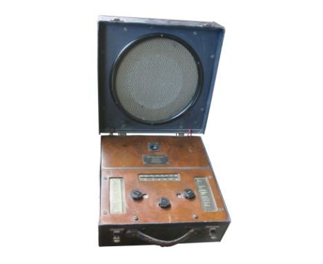 A 4-valve portable radio receiver, McMichael Type MS 367, No. 183850, with circular speaker in lid, in blue leathercloth case