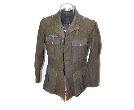 A German Army-style jacket and trousers, complete with badges, dated 1952 to liner please form own opinion of authenticity be