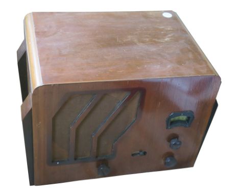 A mains radio receiver, Cossor, Model 635, in wood case of Art Deco design (Condition: see note to Lot 398) 