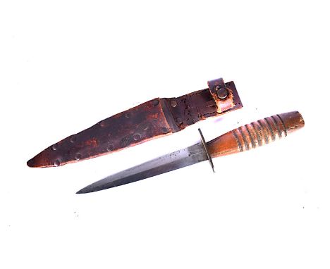 A 3rd Pattern Fairbairn Sykes Fighting dagger, with turned wooden handle, with leather sheath (2) 
