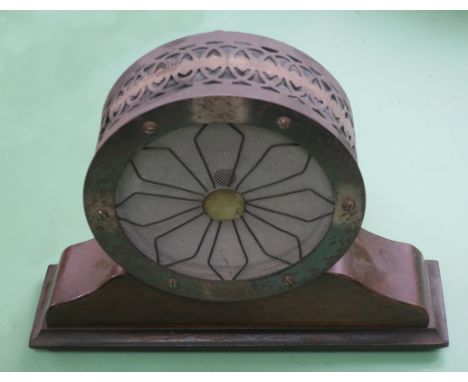 A Beco cone speaker, by British Elecrical Co Ltd, with 'antique' silver fretted surround, on shaped wood base -- the speaker 