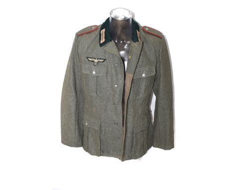 A German Army-style jacket and trousers, with eagle and swastika badge, epaulettes and army collar badges please form own opi