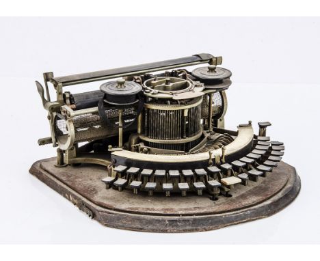A Hammond typewriter, with curved keyboard and one (of two) type shuttles )lacking lid, three keys chipped, needs cleaning) 