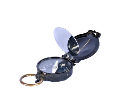 A German pocket signal compass, marked hap 153910 to outer case, opens to reveal compass and signal mirror 