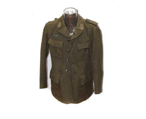 A German Army-style jacket, complete with badges, dated 1952 to liner please form own opinion of authenticity before bidding