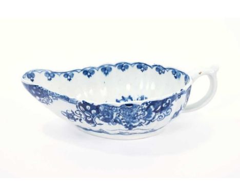 Lowestoft sauceboat, of flat bottomed form with reeded sides, the interior printed in blue with a 'doughnut' tree, an elabora