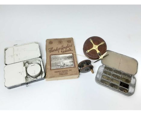 Three vintage fishing roads to include Hardy’s and Allcocks, two wooden reels, the smaller one by J. Gillett, Hardy’s Angler’