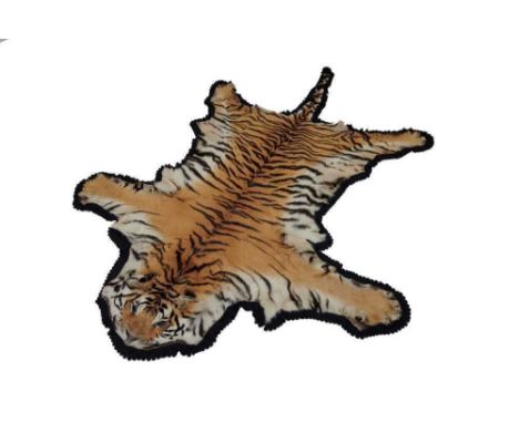 Tiger skin rug with black felt backing, measuring 267cm nose to tail, 182cm paw to paw.Provenance: The vendor's husband was a