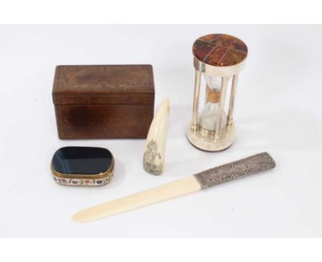 Leather mounted folding cigarette box, with tooled ornament, 14cm wide, together scrimshaw tusk, ivory page turner, an amber 