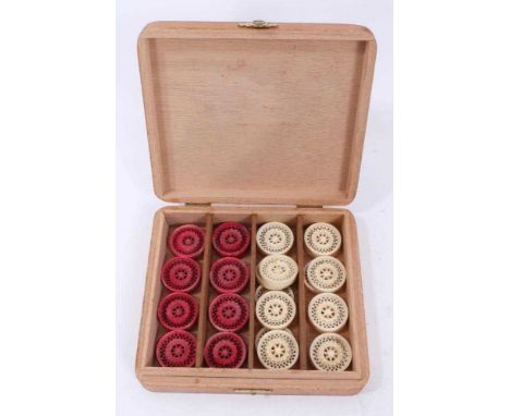 Set 19th century Indian or Chinese export red stained and natural carved ivory backgammon or draughts pieces, set of 32 piece