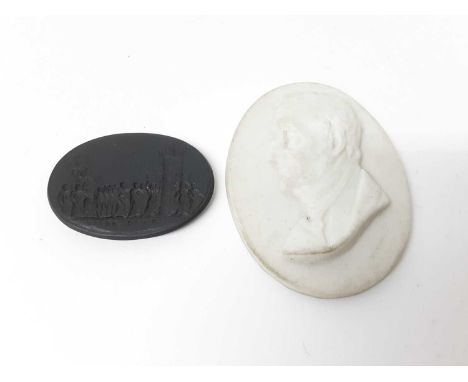 Wedgwood basalt seal decorated with a classical scene, 3.5cm, and a Worcester Kerr &amp; Co portrait medallion of Wellington 