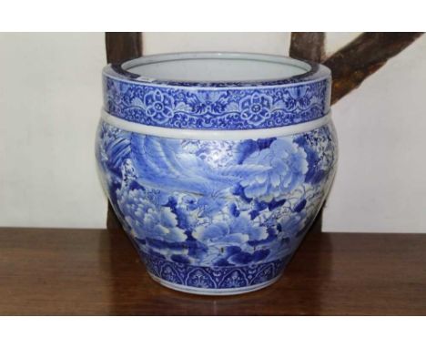 Large Japanese Meiji period blue and white jardinière, decorated with foliate ornament, 41cm high x 48cm diameterProvenance: 