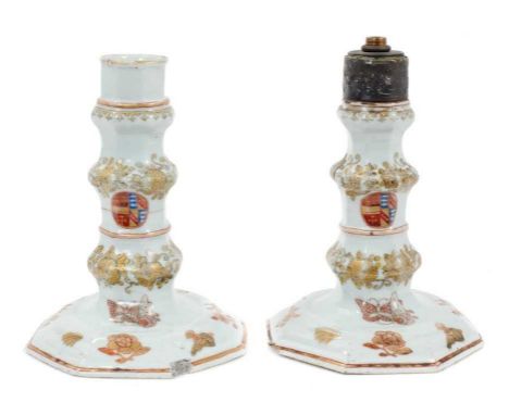 A rare pair of 18th century Chinese armorial porcelain candlesticks, circa 1740, of squat silver form, decorated with flowers