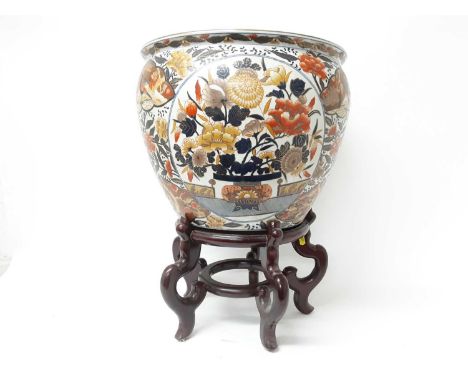 Large pair of Japanese Imari fishbowls on wooden stands, painted with flowers and birds, with goldfish inside, 35.5cm high wi