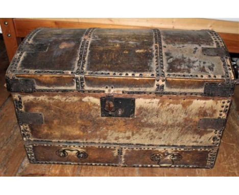 18th century hide and metal stud upholstered dome topped trunk with handed lip, two frieze drawers and carrying handles, 75cm