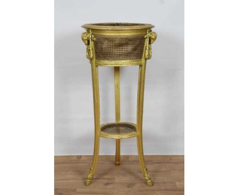 19th century French gilt gesso and caned jardinière stand, circular caned basket and shelf below raised between three guilloc