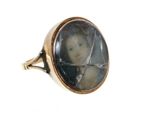 Georgian gold portrait ring with a finely painted oval portrait miniature of a young lady depicted wearing pearl jewellery an