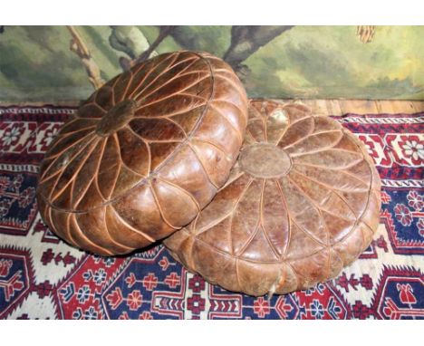 Pair of vintage brown leather circular pouffes, diameter approximately 67cmProvenance: The Robert Barley Collection