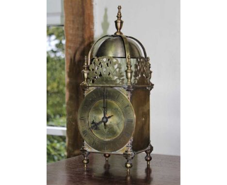 17th century style brass lantern clock, typical form with surmounting bell and brass chapter dial on turned feet, 30cmProvena