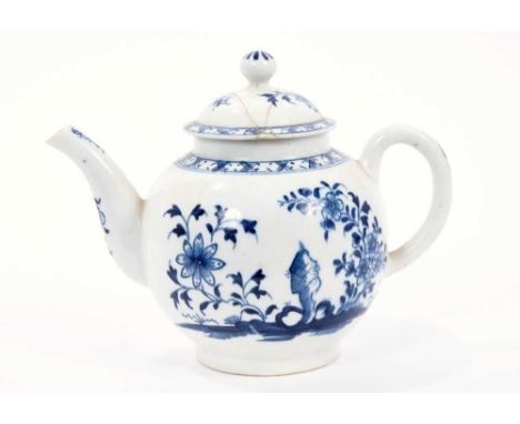 Lowestoft teapot, of globular form with a curved spout and button finial, painted in blue with flowers and rockwork within a 