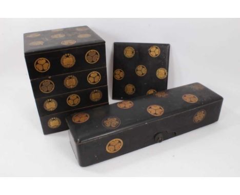 Fine 19th century Japanese black and gilt lacquer stacking box in four sections with two lids and red lacquer interiors, 26cm