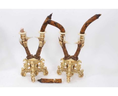 Highly unusual pair of ceramic candlestick, in the Bavarian hunting lodge style, with twin branches imitating carved antlers,