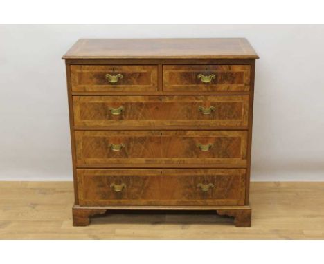 Early 18th century style walnut chest of drawers, with feather banded top and two short over three long graduated drawers on 