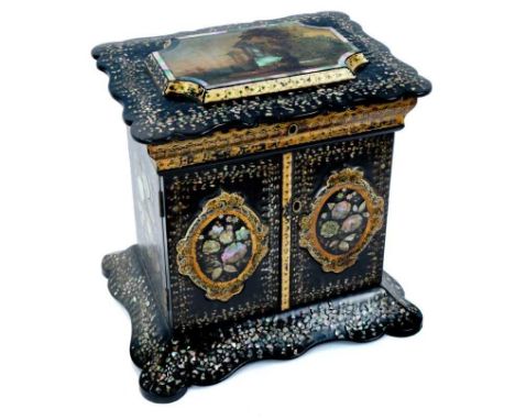 Victorian papier mâché sewing / jewellery cabinet, with lacquered and inlaid mother of pearl decoration. The hinged top, with