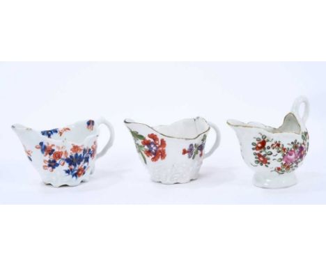 Three Lowestoft cream jugs, the first of Low Chelsea ewer form, painted in Tulip Painter style, 10.2cm wide, the second of th