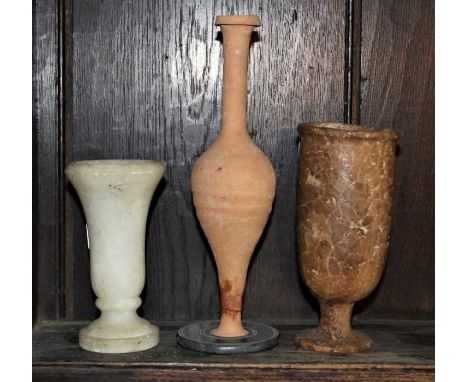 Carved alabaster goblet, possibly ancient, 16cm high, together with a carved white alabaster vessel and a Roman ceramic vase 