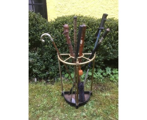 Victorian style demi-lune brass stick stand, together collection of antique and later sticksProvenance: The Robert Barley Col