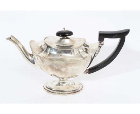 Victorian silver teapot of navette form with oval ebony finial and angular handle, raised on oval pedestal foot, (London 1896