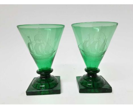 Pair of antique green drinking glasses, circa 1900, engraved with tall ships on lemon squeezer feet, 15cm high (2)Condition r