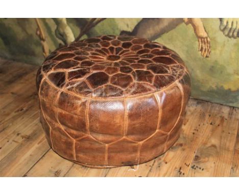 Large vintage brown leather pouffe, approximately 58cm diameterProvenance: The Robert Barley Collection