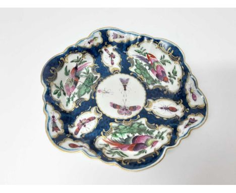 Worcester teapot stand, circa 1770, painted with panels of birds and insects on a blue scale ground, pseudo-Chinese mark to b