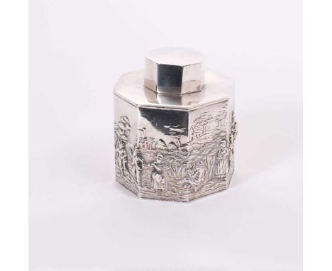 George V silver tea caddy of octagonal form with embossed Dutch style figural decoration landscape, with slip on cover, (Ches