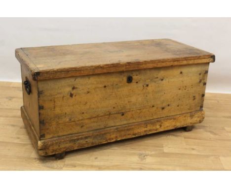 19th century pine trunk, with brass engraved name plaque and flanking iron handles, on plinth base, 107cm wide x 48cm deep x 