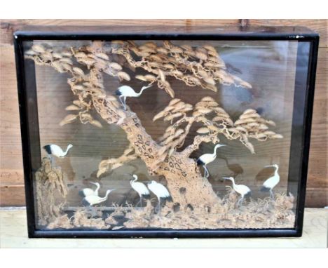 Early 20th century Japanese carved cork panoramic scene depicting storks amongst a tree, in glazed and ebonised box frame, 37