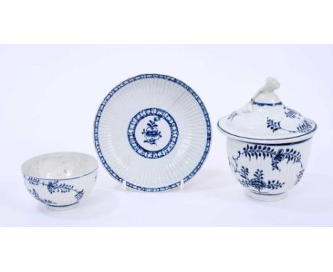 Three Lowestoft pieces, all ribbed, including a sucrier and cover, with flower finial, painted in blue the 'Immortelle' patte