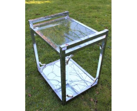 Stylish Deco-style chromium two tier side table with glass top and mirrored base, between square section supports, 66cm wide 