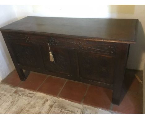 Late 17th century carved oak coffer, with moulded plank top and relief carved frieze over triple panel front on stiles, 108cm