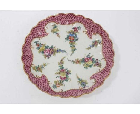 Worcester pink scale bordered saucer dish, of fluted form, the porcelain circa 1770, painted with floral sprays, 20.5cm diame