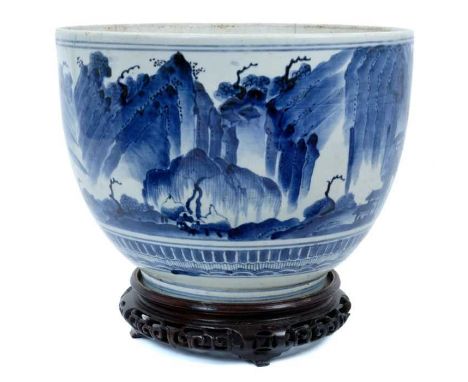 A rare Japanese Arita tureen, late 17th century Edo period, decorated in underglaze blue with a continuous landscape, 30.5cm 