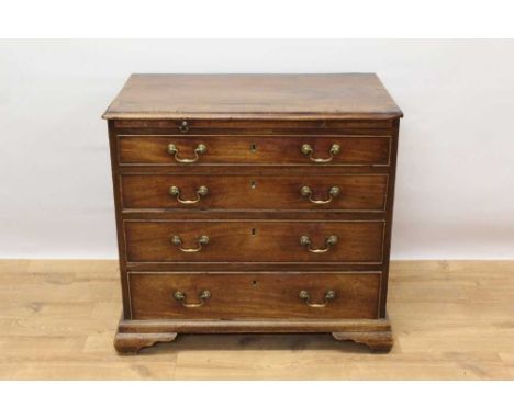George II mahogany dressing chest of small size, with crossbanded top over brushing slide and four graduated drawers, each wi