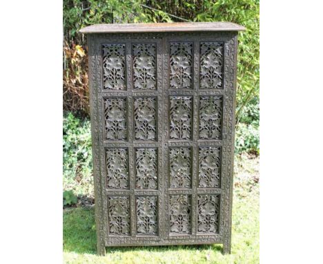 Late 19th/early 20th century Eastern carved and pierced hardwood collapsible cabinet, the rectangular arabesque relief carved