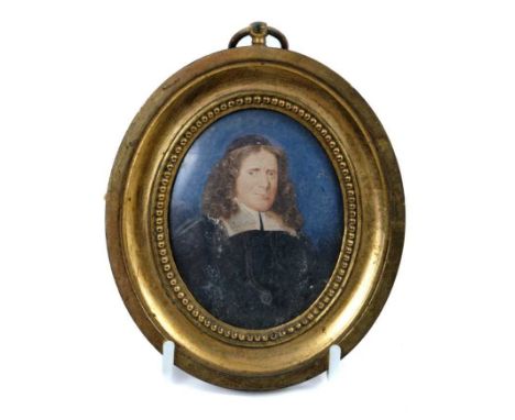 17th century Continental school portrait miniature on ivory depicting a priest against a midnight blue ground, oval, 8 x 6cm,