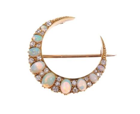 Victorian opal and diamond crescent brooch with nine oval cabochon opals interspaced by old cut diamonds in gold setting with